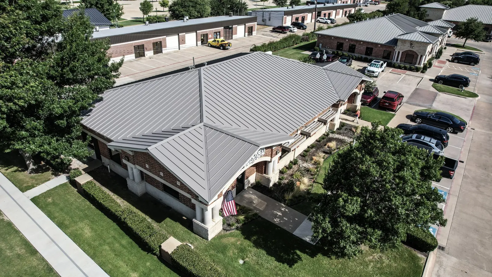 Aerial view of a completed commercial building roof in DFW