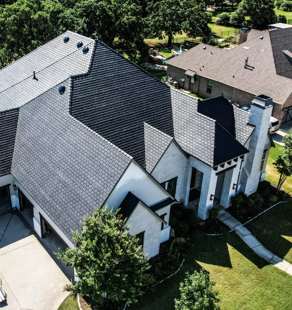 Luxury estate home with a slate-look roof in the Highland Park area
