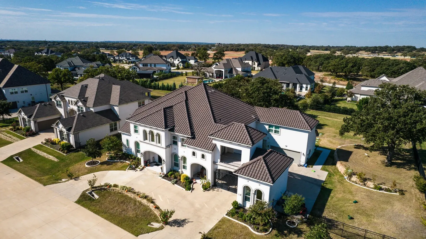 Upscale home with a specialty tile roof in the University Park area