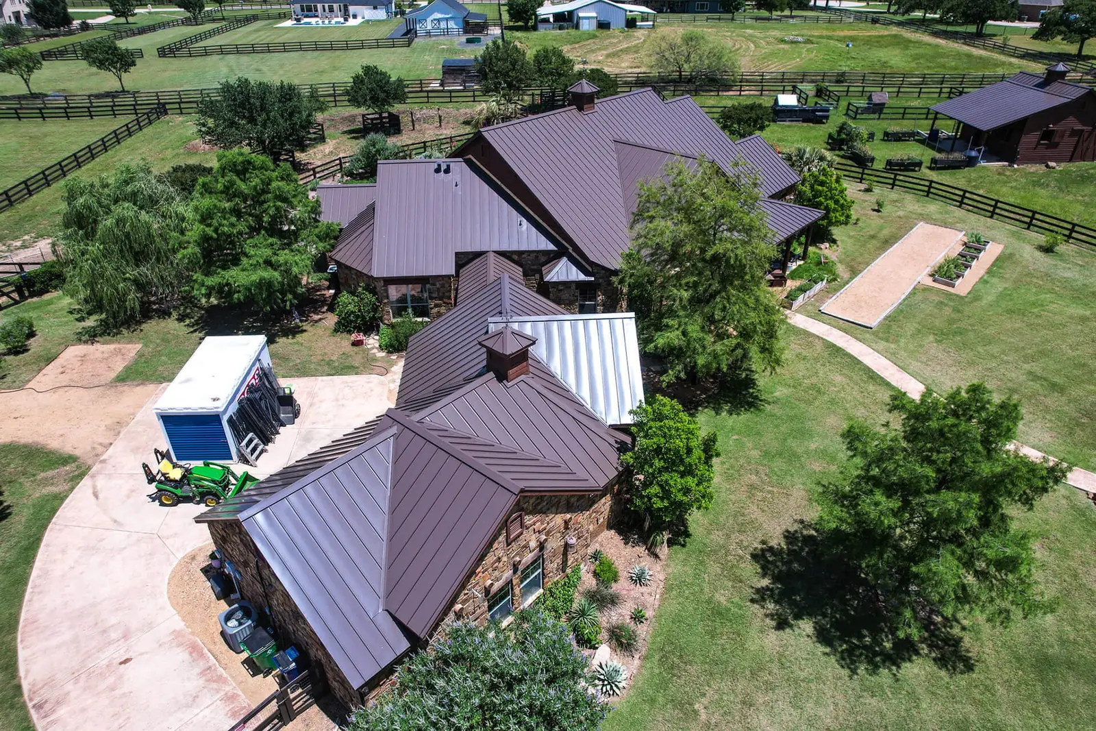Terracotta-toned specialty roof on a DFW-area estate home